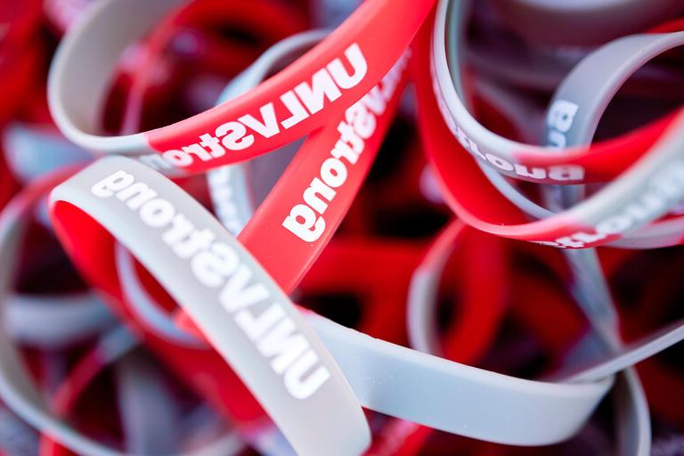 red and gray rubber bracelets with words &quot;UNLV Strong&quot;